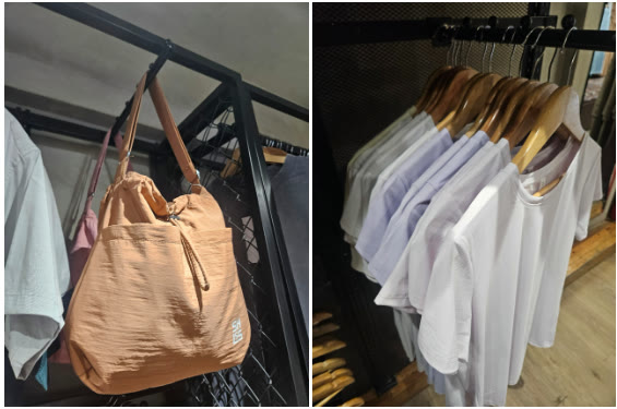 Tas dan kaus yang dipajang di toko Shures